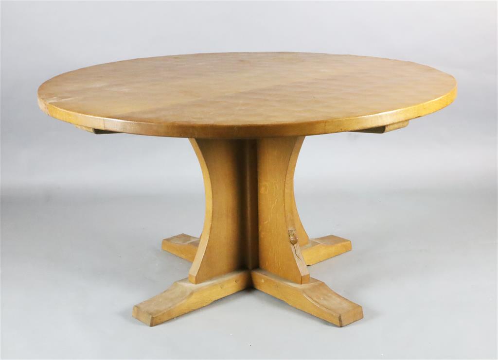 Robert Thompson Mouseman. An adzed oak centre table, Diam.4ft 6in. H.2ft 4.5in.